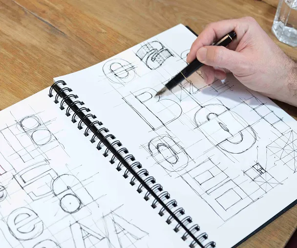 main dessine prototype logo